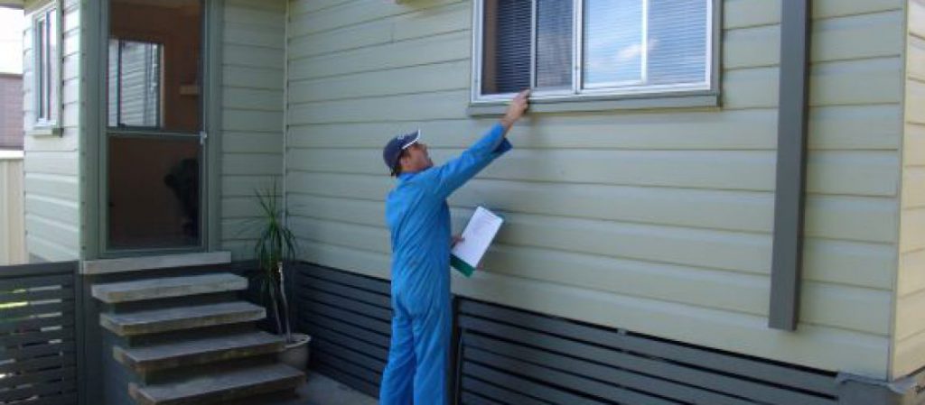 a pest inspector completes a home inspection for termites
