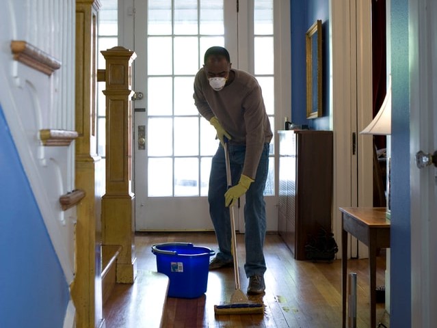home owner cleaning for pest control preparation
