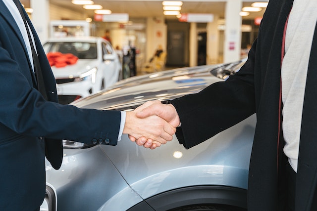 A business owner buys an car thanks to end of financial year car sales 